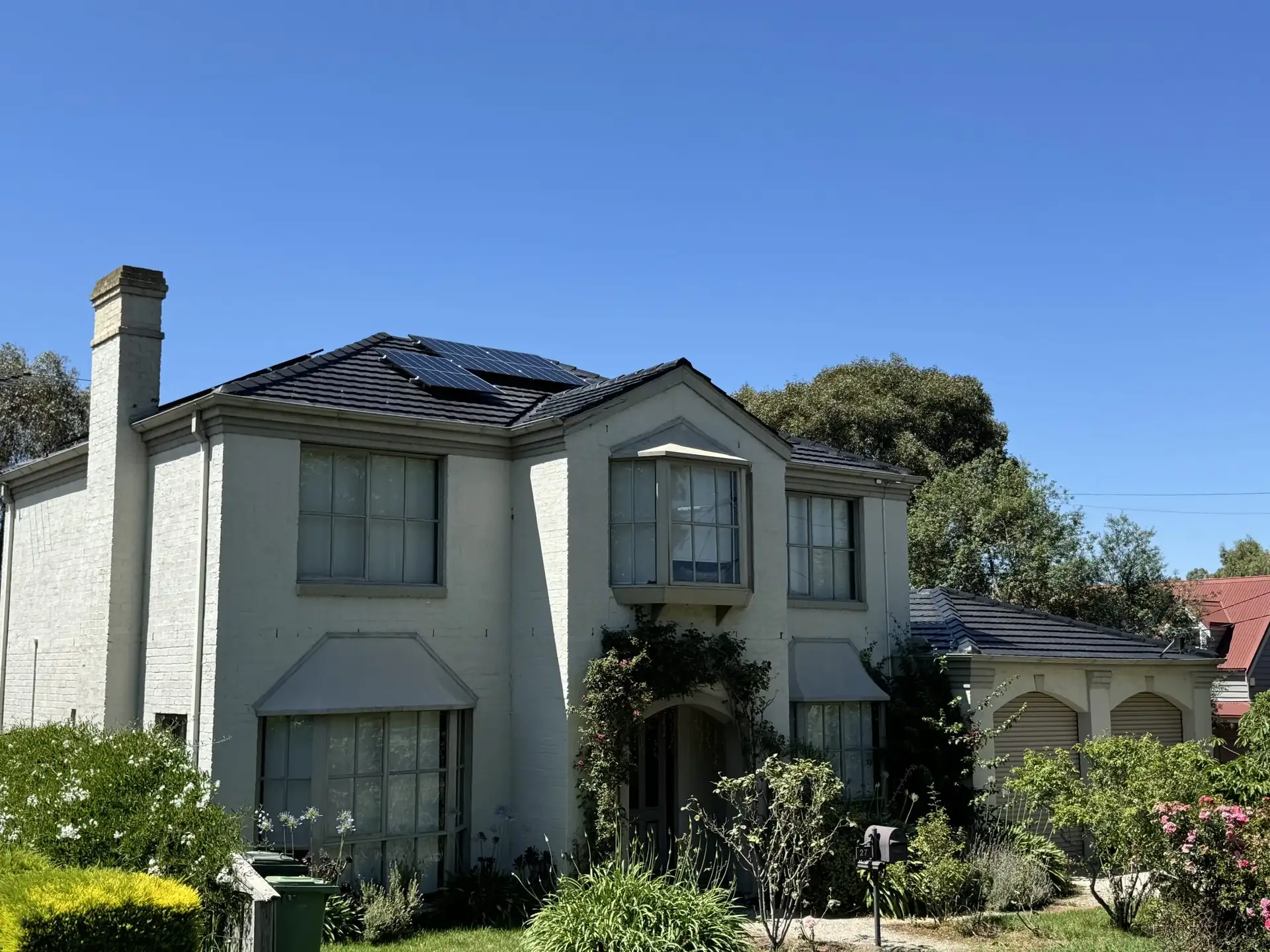 A Sunbury home with a freshly re-pointed and painted tiled roof, a Skyways Roofing job